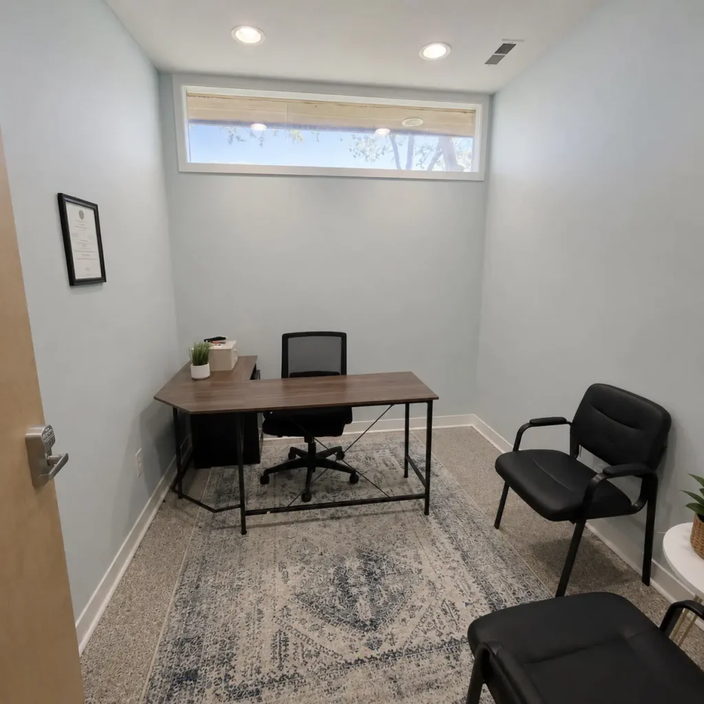 Small professional office with desk and chairs